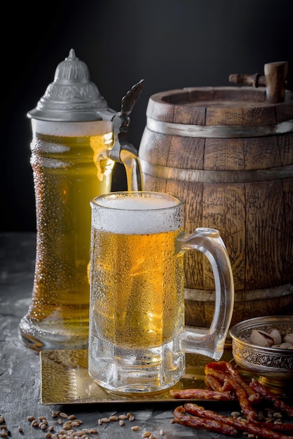 Light beer in a glass on an old background