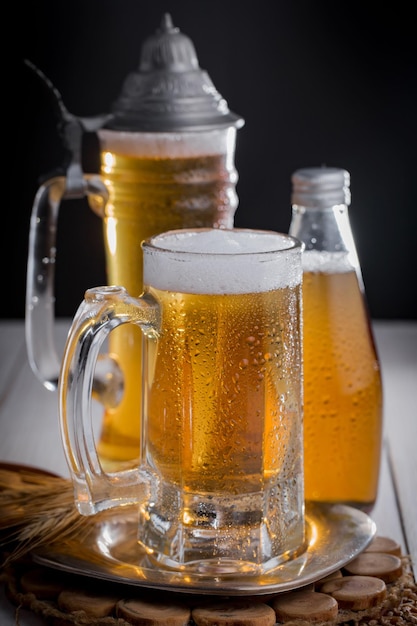 Light beer in a glass on an old background