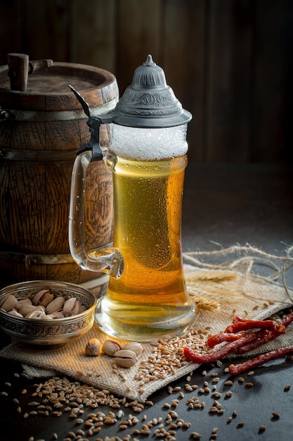 Light beer in a glass on an old background