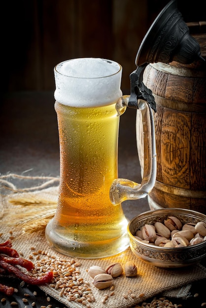 Light beer in a glass on an old background