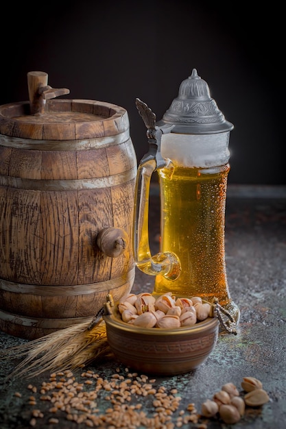 Light beer in a glass on an old background