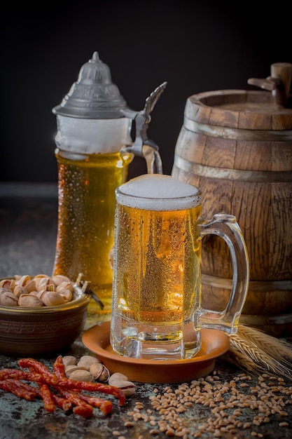 Light beer in a glass on an old background