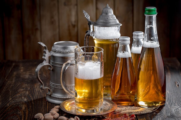 Light beer in a glass on a table in composition with accessories