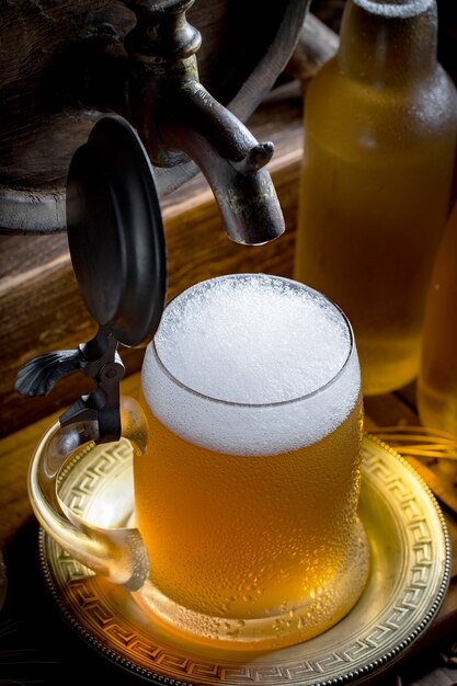 Light beer in a glass on the table