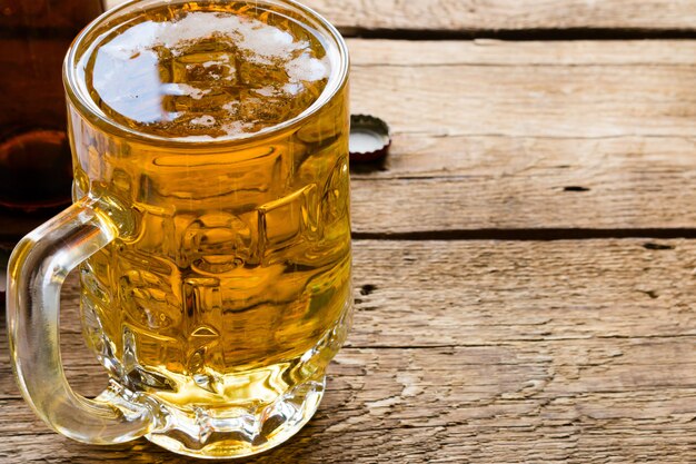 Light beer mug and an empty bottle close up