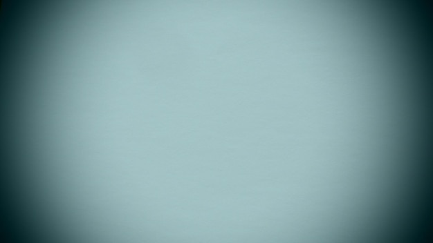 Photo light blue background with dark vignetting around the edges of the image