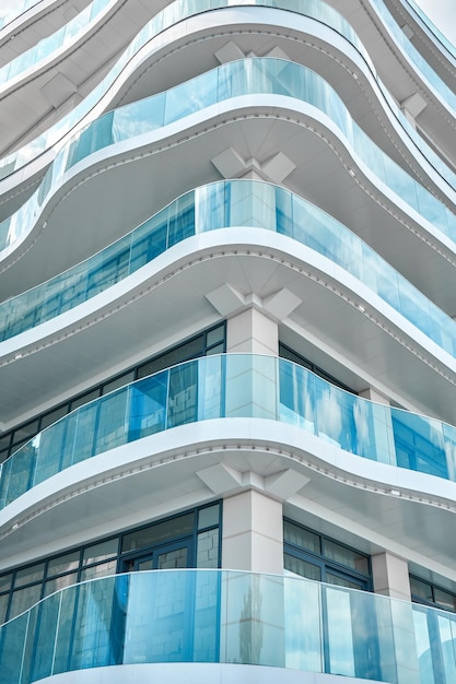 Light blue bent glass fences on fashionable hotel terraces at popular resort