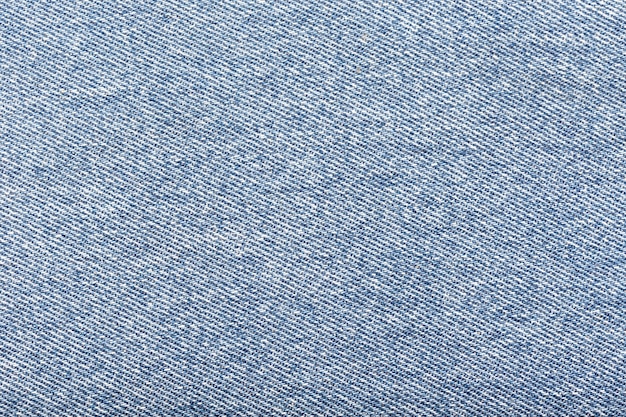 Light blue denim fabric background.