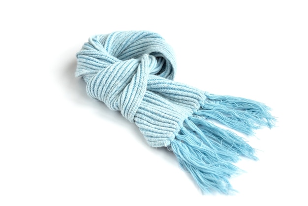 Light blue knitted warm scarf isolated on a white