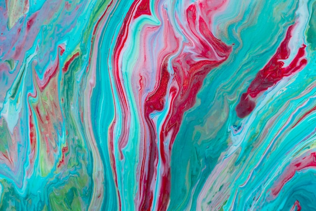 Light blue mixture of fluid acrylic pour painting