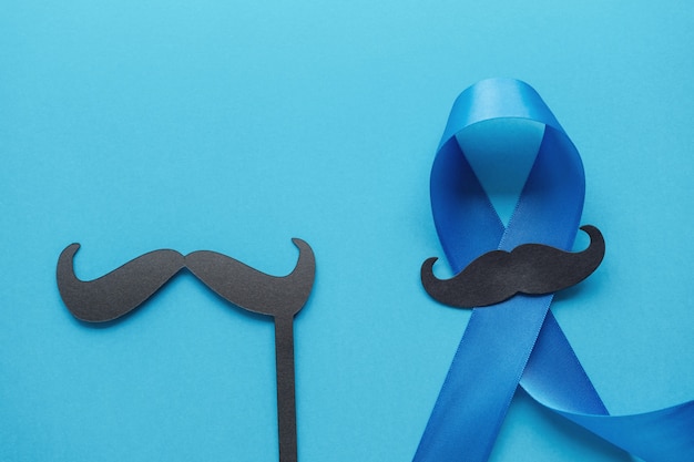 Light blue ribbons with mustache , Prostate Cancer Awareness, Men health awareness, International Men's Day