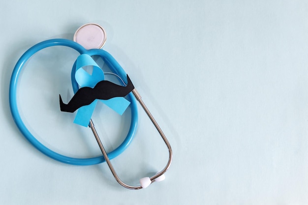 Photo light blue ribbons with mustache prostate cancer awareness men health awareness movember month