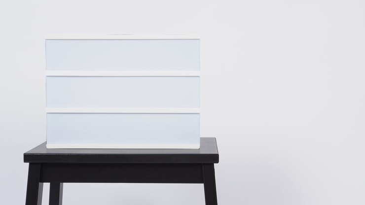 Photo light box sign .it put on table with white background.