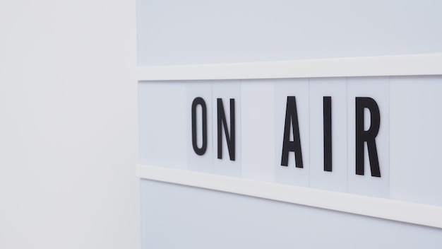 Light box sign with word on air put on table with white background