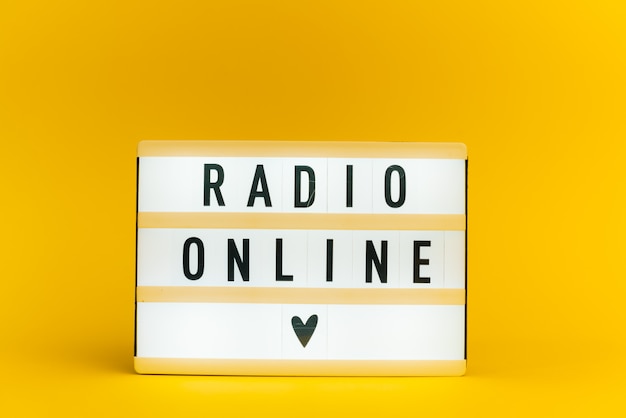 light box with text, RADIO ONLINE, on yellow wall