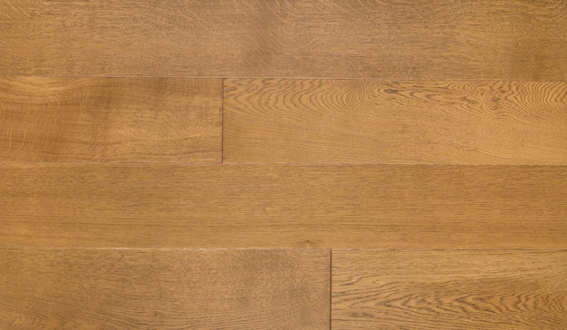 Photo light brown wooden parquet of panels texture