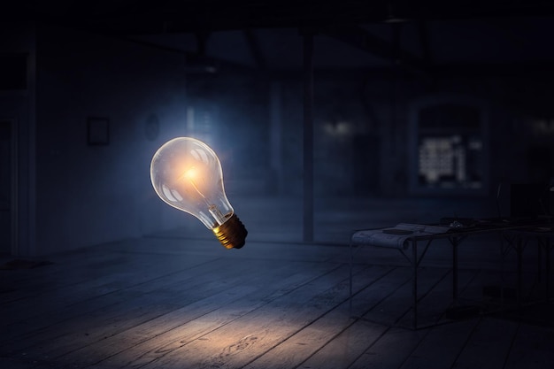 Light bulb as symbol of creativity and new ideas. Mixed media