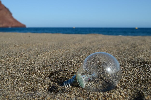 Light bulb on the beach