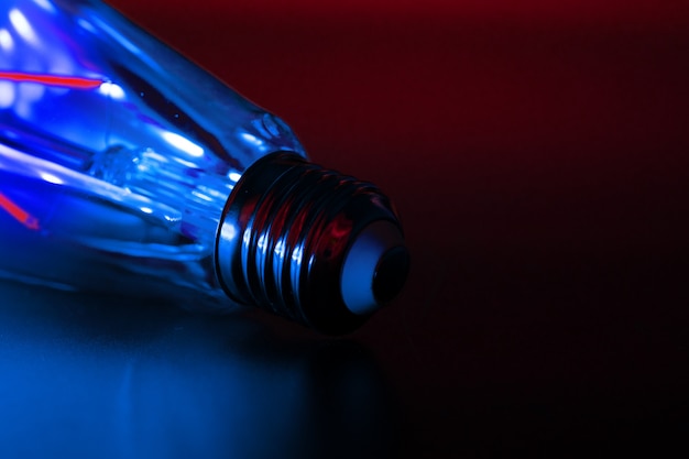 Light bulb on black background close up