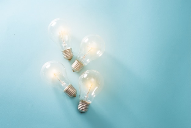 Light bulb on blue background