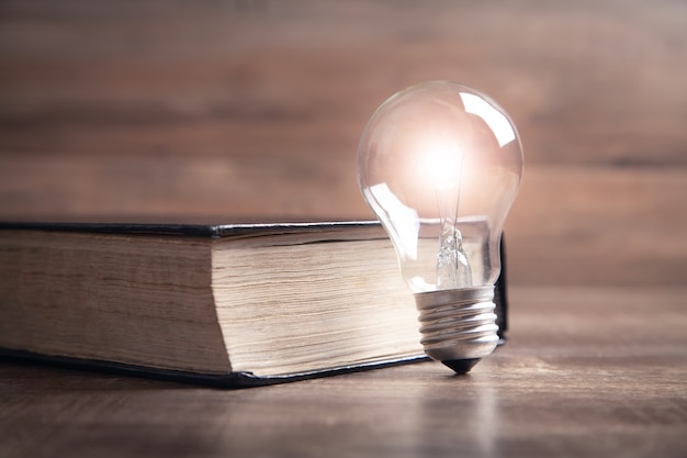 Photo light bulb and book. knowledge and wisdom