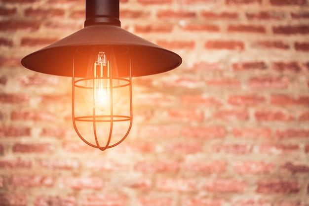 Light bulb on brick wall