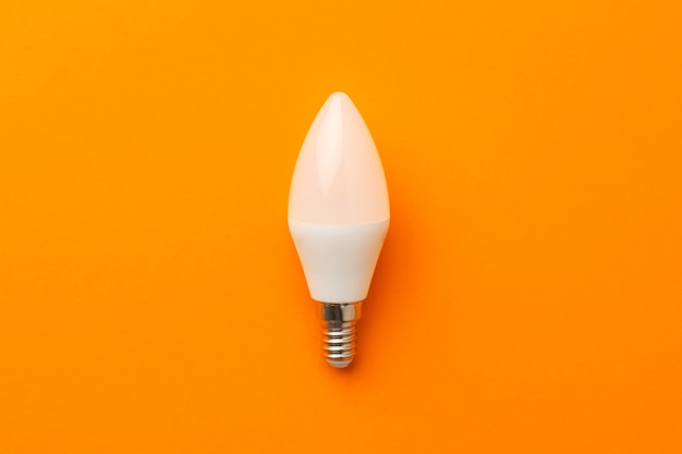 Light bulb on bright orange