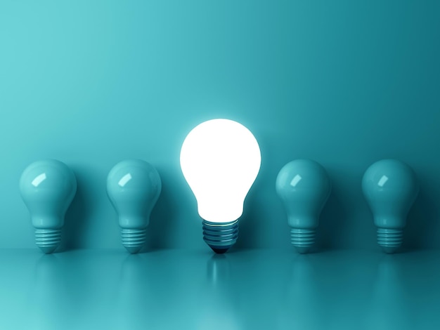 light bulb bright outstanding among lightbulb on blue background concept of creative idea