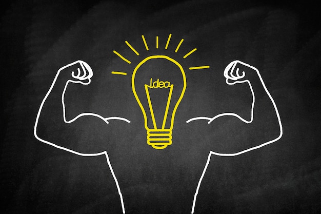 Photo light bulb drawn in yellow with muscular arms