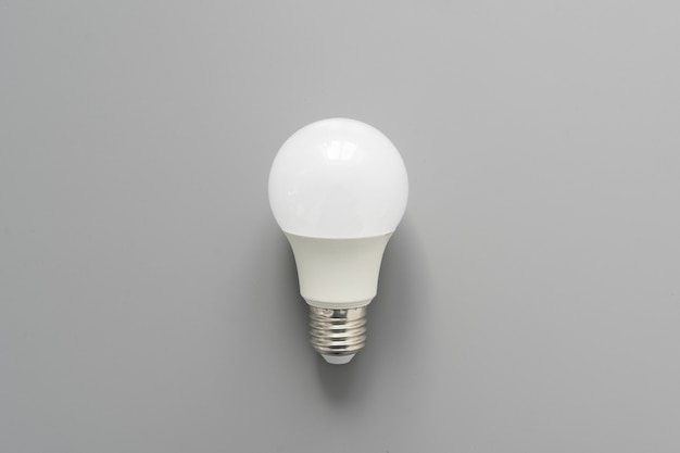 Light bulb on gray background close up