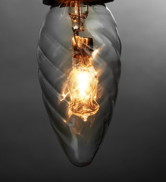 Photo light bulb on grey background