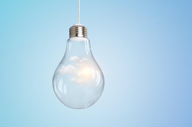 Light bulb on light blue background