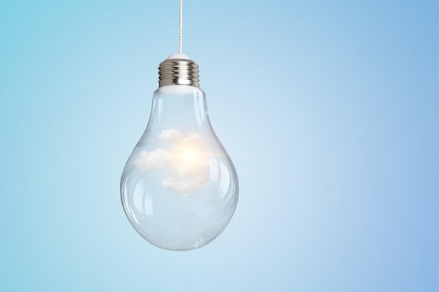 Light bulb on light blue background