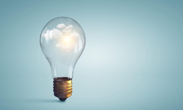 Photo light bulb on light blue background