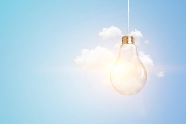 Light bulb on light blue background