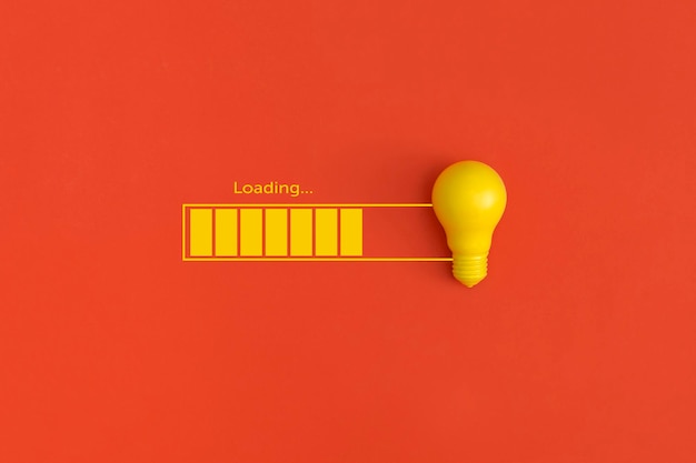 Light bulb and loading on red background. inspiration and\
creative idea concept.