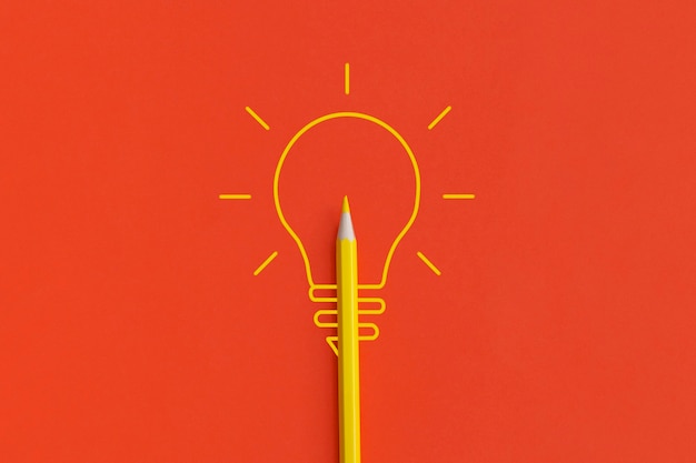 Light bulb on red background. Inspiration and creative idea concept. Top view with copy space. Flat lay composition.