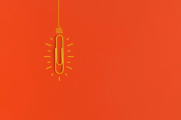 Light bulb on red background. inspiration and creative idea concept. top view with copy space. flat lay composition