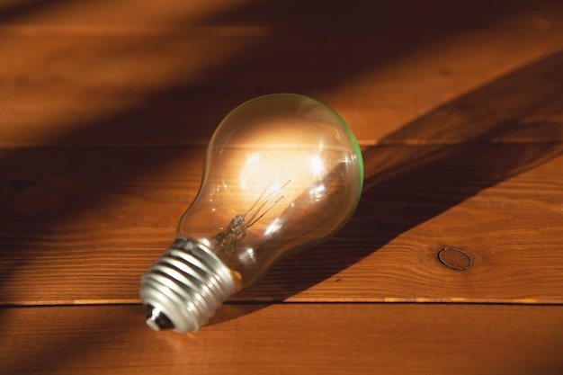 Light bulb on a wooden background. concept ideas