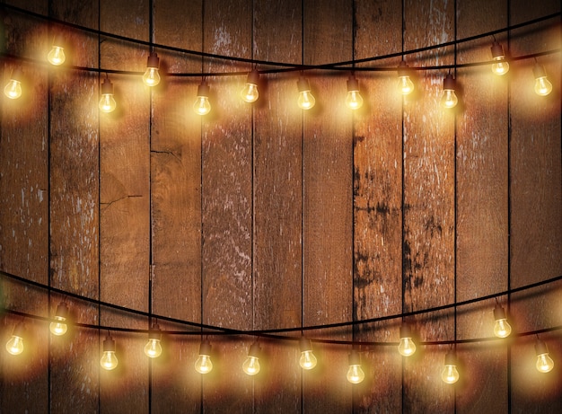 Light bulb on wooden background.