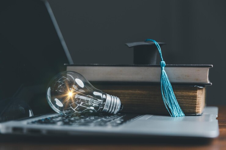 Photo light bulbs and books with graduation hat concept of reading books knowledge and searching for new ideas innovation and inspiration creativity with twinkling lights the inspiration of ideas
