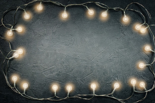 Photo light bulbs on dark gray concrete with copy space