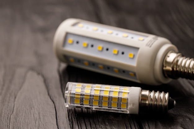 Light bulbs on dark wooden close up