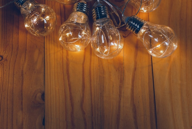 Light bulbs over wooden background