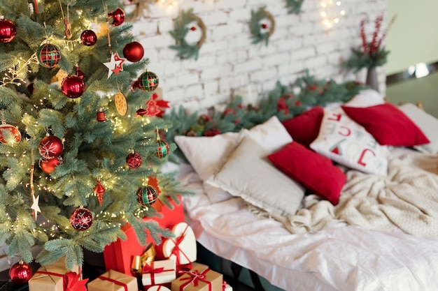 Light Christmas bedroom with red decorations