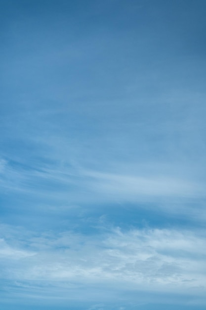 Light cloudy blue sky vertical background