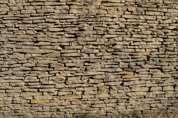 Light colored sandstone wall The texture of the stone