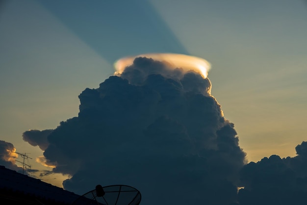 light in the dark and dramatic storm clouds sunset sky