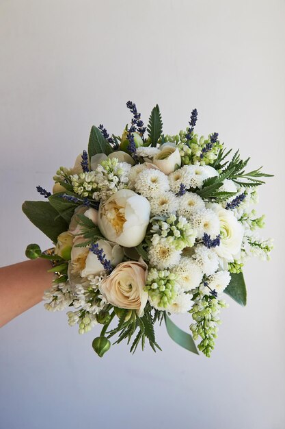 The light delicate bouquet in green and white Ranunculus Buttercup