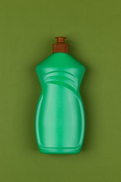 Фото Светло-зеленая пластиковая бутылка жидкости для мытья посуды